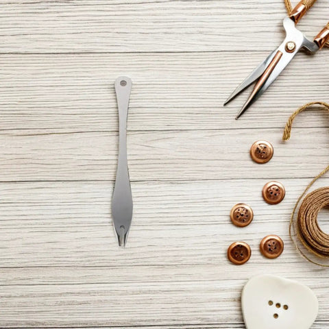 Straight Up Precision Leather Marking Divider And Adjustable Stainless Steel Wing Creaser on wooden surface with buttons and scissors.