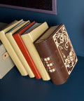 Book Of Secrets Steampunk 3D Puzzle Kit For Adults With Hidden Gears wooden model resembling a book on blue shelf