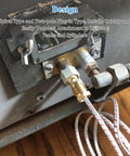 Close-up of gas fryer thermopile/thermocouple with two braided wires on a brass valve.