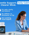 Woman working at desk with bottle of Lithium Orotate 10mg with Magnesium Taurate, for brain health and mood support beside her.