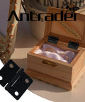Twenty Four Heavy Duty Black Folding Butt Hinges With Smooth Swivel Function And Included Mounting Screws For Fast Cabinet Fixes and Woodworking Builds That Are Hella Durable And Ready To Roll displayed on a wooden jewelry box.