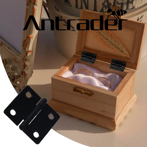 Twenty Four Heavy Duty Black Folding Butt Hinges With Smooth Swivel Function And Included Mounting Screws For Fast Cabinet Fixes and Woodworking Builds That Are Hella Durable And Ready To Roll displayed on a wooden jewelry box.
