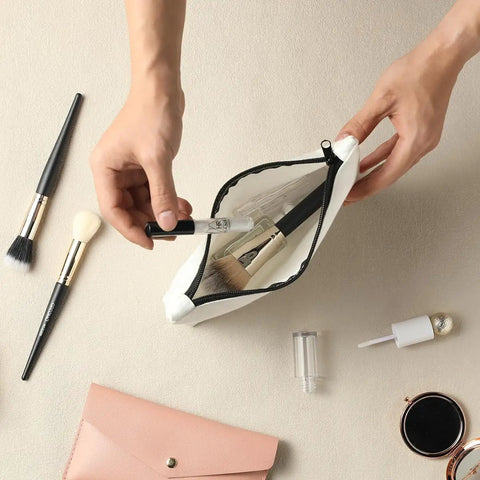 Hands placing cosmetics in a Makeup Bag for Engineers Women Students - Durable Canvas Cosmetic Organizer 10 By 6 Inches