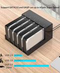 Usb 3.0 Hdd Docking Station And Sata Hard Drive Enclosure Case Featuring Tool Free Hot Swap Functionality For Up To Fifty Terabyte Storage Drives Delivering Blazing Speeds And A Straight Up Dependable Connection You Deserve on wooden table with data transfer speeds shown.