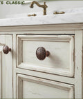 Antique Copper Kitchen Cabinet Knobs Set For 1.4 Inch Cabinets shown installed on vintage white cabinet drawers, solid zinc alloy.