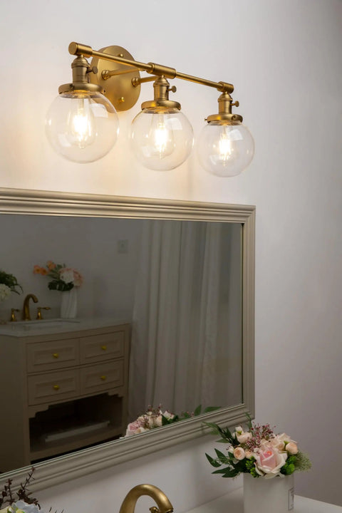 Three Light Vintage Industrial Bathroom Vanity Wall Sconce With Handblown Clear Glass Globes And Antique Gold Finish, 25.2 Inch Wide Triple Light Bath Fixture