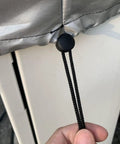 Close-up of adjustable drawstring and toggle on the Rock Solid Weatherproof Cover For Your EV Charging Station.