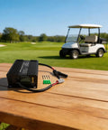 Built Tough 1000W Solar Charge Controller 24V To 72V No Nonsense Battery Charger on wooden table near golf cart.