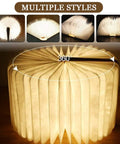 Wooden Folding Mood Light Book Lamp with USB Rechargeable Battery in circular 360-degree open style, emitting cozy glow.