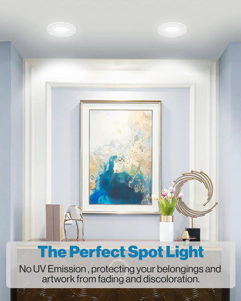 Room with 5 To 6 Inch LED Can Lights Retrofit Recessed Lighting With Gimbal Downlight illuminating artwork on a wall.