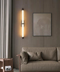 JGSYD Led Modern Wall Lamp Indoor with Remote Control Wall Light 2700K-6500K Dimmable Wall Sconce Long Strip Decorative Wall Lighting Stainless Steel for Bedroom Hallway Living Room,Black-70Cm on a living room wall.