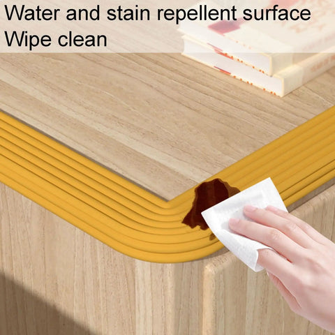 Edge Corner Protector Foam Padding For Sharp Furniture Edges Soft NBR Bumpers being wiped clean on a wooden table