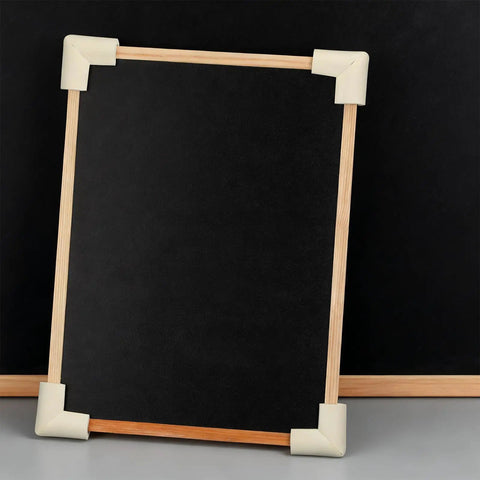 White Foam Corner Protectors 12-Piece U-Shaped Edge Guards for Furniture and Photo Frames on a wooden frame.