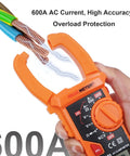 Auto Ranging Clamp Meter For Electricians, Measures AC Current Up To 600A And AC And DC Voltage Up To 600V, shown in hand.