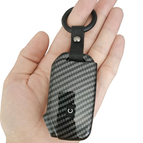Durable Key Fob Cover For Kia Keyless Remote With Glow In The Dark Silicone Button Pad And ABS Protector Case in hand