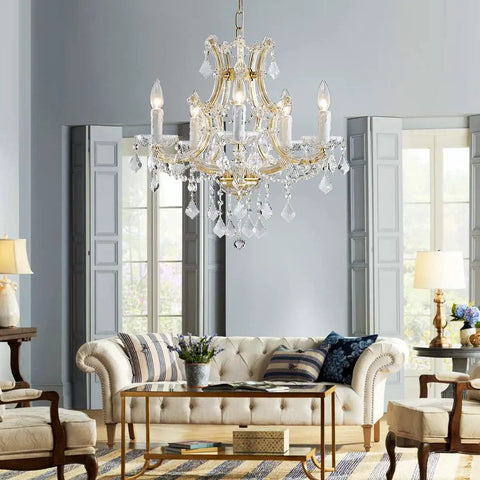 Gold 5 Light Maria Theresa Crystal Chandelier With Adjustable Chain Up To 52 Inches E12 Bulb Ready LED in a stylish living room