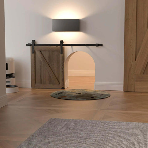 4 Foot Mini Sliding Barn Door Hardware Track Kit For 21 To 24 Inch Doors installed above pet doorway in cozy room