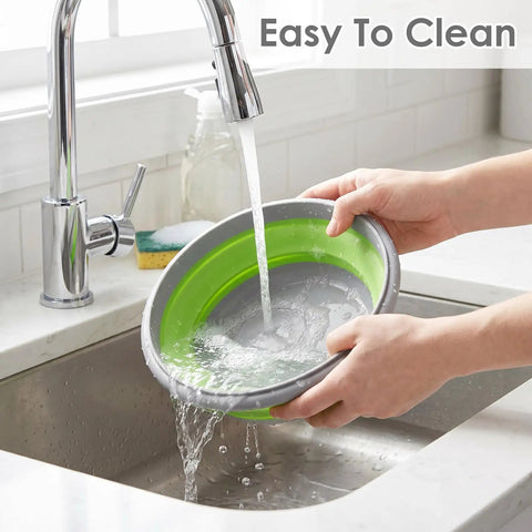Washing a green 300ml collapsible silicone bowl from the Collapsible Silicone Camping Bowl Set With Lids 6 Pack Food Grade.