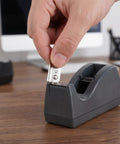 Hand inserting Stainless Steel Serrated Tape Dispenser Blades Replacement Knife into tape dispenser on desk.