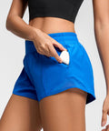 Model wearing Women's Low Rise 2.5 Inch Running Shorts With Built In Liner No Chafe Quick Dry Lightweight Gym Shorts, showing zip pocket