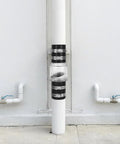 QWORK CV-150 silent check valve, 1-1/2 in, clear body with steel clamps, installed on PVC riser.