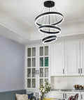 Modern Black LED Ring Chandelier With Three Adjustable Tiered Cylinders hangs over a kitchen island with bright white illumination.