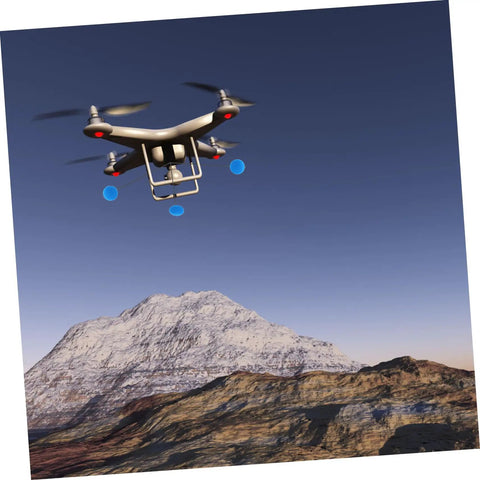 Three Set RC Helicopter Training Kit with Sponge Foam for Airplanes and Helis flying near a mountain, aerial view.