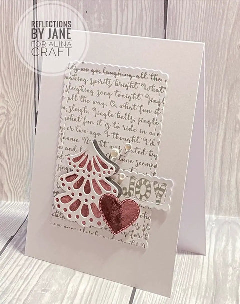 Handmade card featuring a scalloped border die cut with a Christmas tree, heart, and text design using 24 Piece Nesting Frame Die Cut Set.