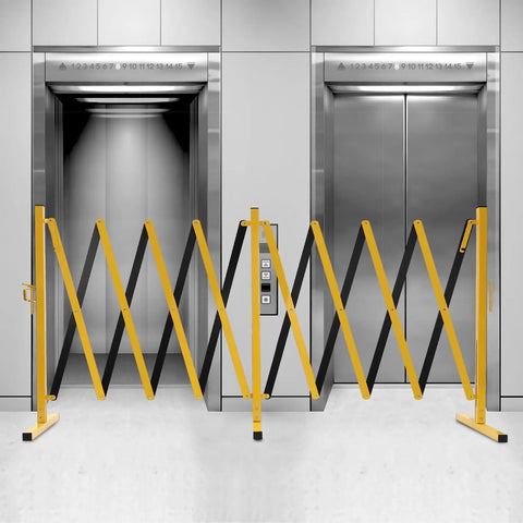 Hardcore Expandable Metal Barricade, Pro Ready Portable Safety Fence With Rock Solid T Base, Zero Hassle Folding Traffic Barrier Gate For Construction Zones And Crowd Control In High Vis Yellow set up in front of elevators.