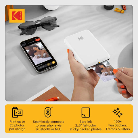 Person using Step Instant Smartphone Photo Printer On The Go Portable Mini Color Wireless Printer For iOS And Android Bluetooth Printing From Your Phone With Zink 2x3 Sticky Back Photos And Free Editing App White.