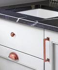 Installed 10 Pack 3 Inch Vintage Cup Pulls Antique Copper Cabinet Hardware on kitchen drawer, showing design and finish