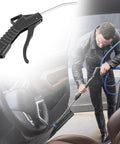 Eight Piece Heavy Duty Pistol Grip Air Blower Gun With Angled Nozzle For Kicking Up Dust And Grime In The Shop Or House being used for detailed car cleaning.
