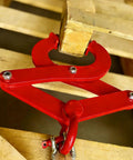 Pallet puller clamp, red, side view gripping a wooden beam with 5.5-inch jaw opening