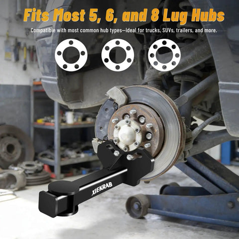 Upgraded Wheel Hub And Bearing Removal Tool Kit Pro Grade Heavy Duty Hub Puller installed on vehicle hub in garage.