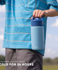 Child holding Disney Princess 14oz Kids Water Bottle With Straw Lid Insulated Stainless Steel Tumbler in blue, outdoors.
