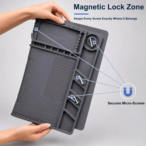Hands holding a grey Top Tier Heat Resistant Silicone Soldering Mat With Magnetic Screw Retainer Tray showing magnetic screw zones.