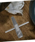 Double Head Screw Extractor Set for Stripped Screws and Broken Water Pipes on wooden surface