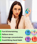 Woman holding a Gear Ball Fidget Toy from 4 Pack For Stress Relief And Focus 3D Printed GearSphere Spin Cube Multicolor Set