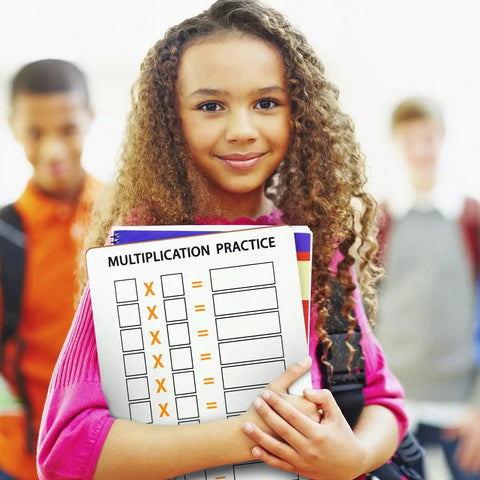Girl holding Dry Erase Multiplication Chart Whiteboard 11 By 14 Inches Double Sided Times Table For Classroom And Home Kid Friendly