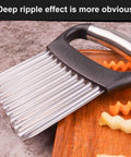 Crinkle cutter with silver stainless steel wavy blades and black ergonomic handle for potatoes and vegetables.