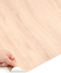 Dead Simple Peel And Stick Faux Wood Contact Paper For Kitchen Counters And Shelves Self Adhesive Vinyl Liner in beige, showing peel process.