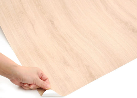Dead Simple Peel And Stick Faux Wood Contact Paper For Kitchen Counters And Shelves Self Adhesive Vinyl Liner in beige, showing peel process.