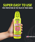 Hand holding 10oz Fire Safety Spray Handheld Fire Suppressor Non Toxic PFAS Free Easy To Use Compact for home use.