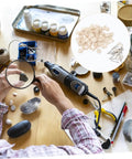 Person using drill with 120-piece Wool Felt Polishing Wheel Set for metal and jewelry finishing on crafting table.