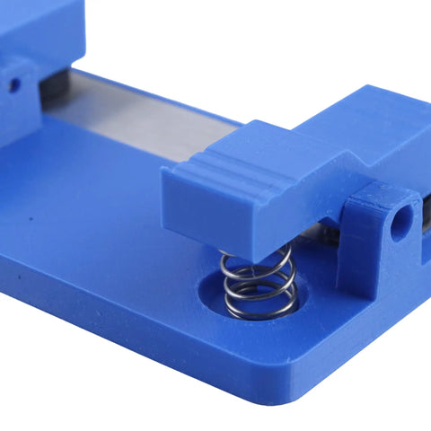Super Grippy LED Strip Soldering Jig Helper Dual Clamp PCB Hold Down Tool close-up showing blue base and spring mechanism.