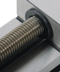 Close-up of Versatile QGG50 Surface Grinder Toolmaker Vise With Integrated V-Grooves showing threaded screw mechanism for CNC workholding.