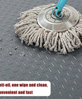 Mop cleaning surface of Heavy Duty Red PVC Garage Floor Mat Roll 1.5x2m Cuttable, Non Slip, Easy to Clean, Durable Floor Protector