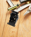 Heavy Duty Folding Table Hinge With 90 Degree Self Locking Mechanism Iron Hidden Folding Table Leg Bracket on wood surface