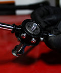 Close-up of Metric And SAE Tap And Die 60-Piece Rethread Set For Cutting External And Internal Threads being used by gloved hands.