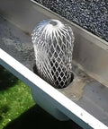 Expandable 3.5 Inch Aluminum Gutter Downspout Guards 4 Pack Leaf Filter Strainer Protectors installed in gutter to prevent clogs.